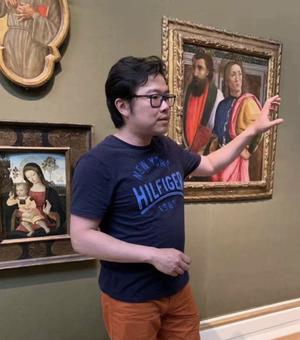 Ang Li Standing in Art Gallery.